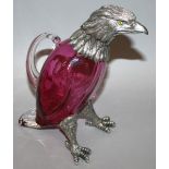 A CRANBERRY GLASS EAGLE CLARET JUG with plated head and feet 9.5ins high.