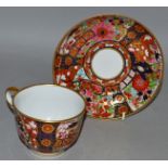 AN EARLY 19TH CENTURY WORCESTER BARR FLIGHT AND BARR TEACUP AND SAUCER, painted in a bright imari