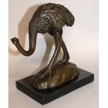 MILO A BRONZE STANDING OSTRICH. Signed 6.5ins high, on a marble base.