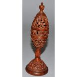 A GOOD CARVED AND PIERCED NUT POMANDER 6ins high.