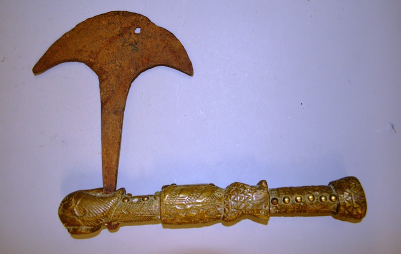 AN EARLY TRIBAL BRASS AND IRON AXE.