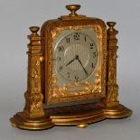 A GOOD SMALL STRUTT ORMOLU CASED CLOCK, attributed to THOMAS COLE with silvered dial 3.5ins high.