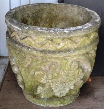 A PAIR OF RECONSTITUTED STONE CIRCULAR URNS with moulded decoration. 1ft 3ins high.