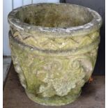 A PAIR OF RECONSTITUTED STONE CIRCULAR URNS with moulded decoration. 1ft 3ins high.