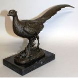 MILO A BRONZE PHEASANT. Signed 12ins wide, on a marble base.