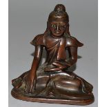 A SMALL BRONZE SEATED BUDDHA 4.5ins high.