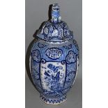 A LARGE DELFT BLUE & WHITE VASE AND COVER 18ins high.