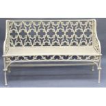 A GOOD GOTHIC DESIGN CAST IRON CREAM PAINTED GARDEN BENCH with Gothic design back, arms and seat.