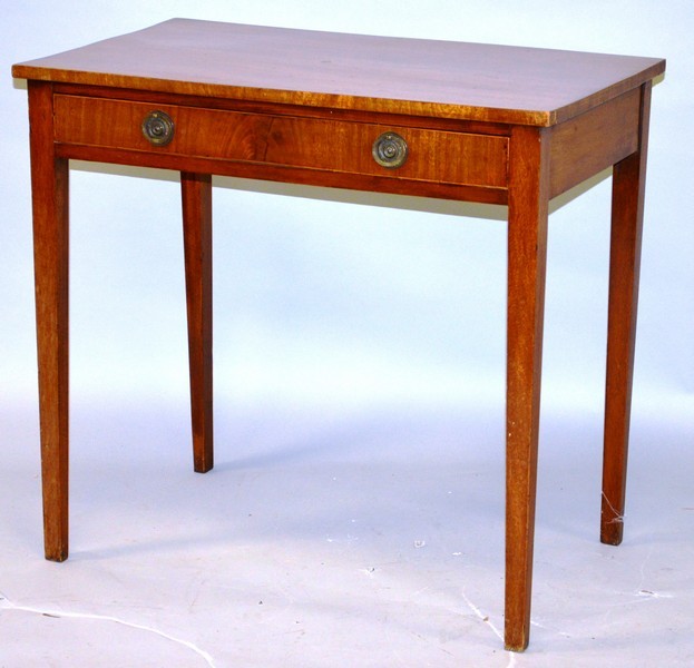 A GEORGE III MAHOGANY SIDE TABLE with a single frieze drawer, brass ring handles, on tapering square