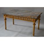 A RECTANGULAR MARBLE TOP COFFEE TABLE on a gilt base.