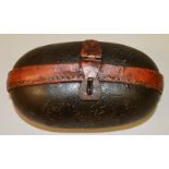 AN UNUSUAL OVAL SHAPED LEATHER BOX with iron clasps 7.5ins long.