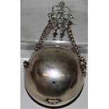 A GEORGE V SILVER BALL SHAPED STRING TIDY with chain. Edinburgh 1910 Maker: M. & C.