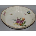 AN 18TH CENTURY LUDWIGSBURG BOWL with basket weave border painted with flowers, crown in under-glaze