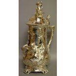 A LARGE WMF PLATED STEIN, dated 1911, decorated with classical figures in relief 16ins high.