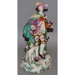 AN 18TH CENTURY DERBY FIGURE OF A GALLANT, standing with sweeping cape, beside a dog and flowering