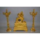 A STUNNING QUALITY EMPIRE GILT BRONZE THREE PIECE CLOCK GARNITURE, the clock by C. F. Petit, with