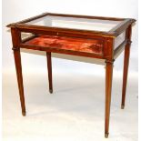 A GOOD MAHOGANY AND BRASS LINE INLAID BIJOUTERIE TABLE, the rectangular top with extended corners,