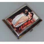 A GEORGE V SILVER CIGARETTE CASE, Birmingham 1928, with a nude and an Arab.