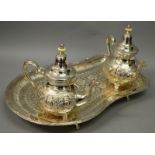 A PERSIAN DESIGN TRAY AND TWO COFFEE POTS.