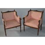 A GOOD PAIR OF FRENCH CARVED BEECH WOOD ARMCHAIRS with striped upholstery on turned legs.