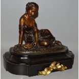 A 19TH CENTURY FRENCH BRONZE OF A RECLINING CLASSICAL YOUNG LADY on a black marble base. Bronze: