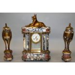 A GOOD ART DECO THREE PIECE GREY MOTTLED MARBLE CLOCK SET, the clock with eight day movement, column