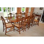 A VERY GOOD GEORGIAN STYLE MAHOGANY DOUBLE PILLAR DINING TABLE with two loose leaves with reeded