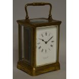 A LARGE BRASS CARRIAGE CLOCK TIMEPIECE, SQUIRE & SON, BIDEFORD 5.5ins high.