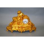 A GOOD 19TH CENTURY FRENCH GILT BRONZE CLOCK with eight day drum movement, with reclining