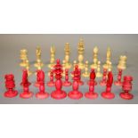 A RED AND WHITE TURNED IVORY CHESS SET. John Nicholsons Auctioneers do not ship items containing