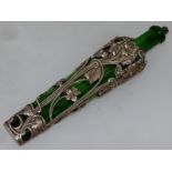 AN EDWARD VII LONG GREEN GLASS AND SILVER MOUNTED SCENT BOTTLE AND STOPPER 8.25ins long. London 1902