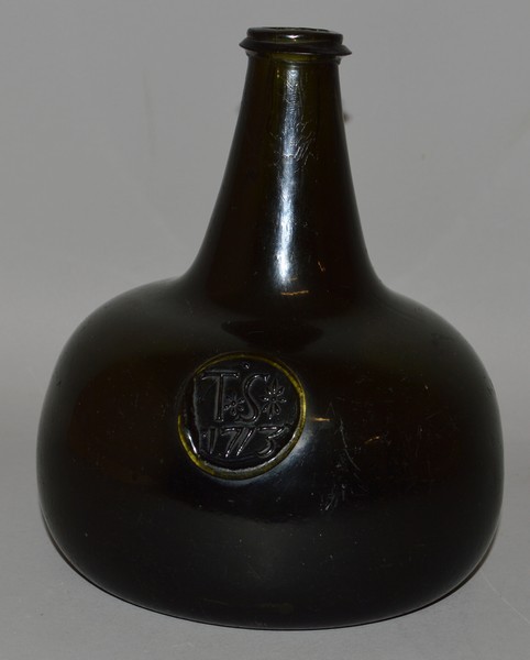 A GOOD TRANSITIONAL PERIOD ONION/BLADDER BLACK GLASS BOTTLE, dated 1713, T. S. with two stars,