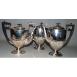 THREE SEMI FLUTED URN SHAPED COFFEE POTS.