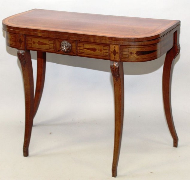 A GEORGE III MAHOGANY FOLD-OVER CARD TABLE, of “D” shape with crossbanded, inlaid and line inlaid