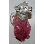 A CRANBERRY GLASS BEAR CLARET JUG with plated mounts 8.5ins high.