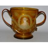 AN IMPORTANT PIECE OF SCOTTISH HISTORY (unfortunately damaged), A LARGE AMBER GLASS TWO HANDLED