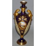 AN EARLY 20TH CENTURY COALPORT TWO HANDLED VASE, lavishly decorated in raised gilt with a central
