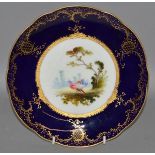 AN EARLY 20TH CENTURY COALPORT, painted and signed by F. HOWARD, with two exotic birds in