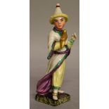 AN 18TH CENTURY LUDWIGSBURG FIGURE OF AN ORIENTAL MAN dressed in a conical hat, holding a parrot,