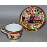 AN EARLY 19TH CENTURY WORCESTER FLIGHT BARR PERIOD TEACUP AND SAUCER, painted in another bright