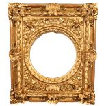 19th Century Italian School. A Carved Giltwood Frame, with Swept Centres and Corners, and Four