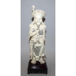 A GOOD EARLY 20TH CENTURY CHINESE IVORY FIGURE OF GUANDI, together with a fixed wood stand, the