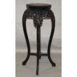 A 19TH/20TH CENTURY CHINESE MARBLE TOP HEXAGONAL CARVED HARDWOOD STAND, with curving feet and