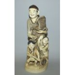 A LARGE GOOD QUALITY EARLY 20TH CENTURY SIGNED JAPANESE IVORY OKIMONO OF A FISHERMAN IN THE