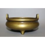 ANOTHER CHINESE POLISHED BRONZE CENSER, of shallow form, weighing 1.02Kg, with double upright lug