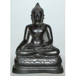 A 19TH/20TH CENTURY THAI BRONZE BUDDHA, seated in dhyanasana on a shaped triangular lotus plinth,