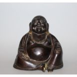 A CHINESE BRONZE FIGURE OF BUDAI, the jovial God seated and holding beads, 5.1in wide at widest