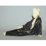 A GOOD EARLY 20TH CENTURY SIGNED JAPANESE IVORY & PATINATED BRONZE MODEL OF A RECLINING LADY, her