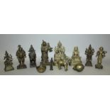 A GROUP OF ELEVEN 19TH/20TH CENTURY NEPALESE & INDIAN BRONZES, including two buddhas on lotus