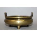 A CHINESE POLISHED BRONZE CENSER, of shallow form, weighing 890gm, with double upright lug